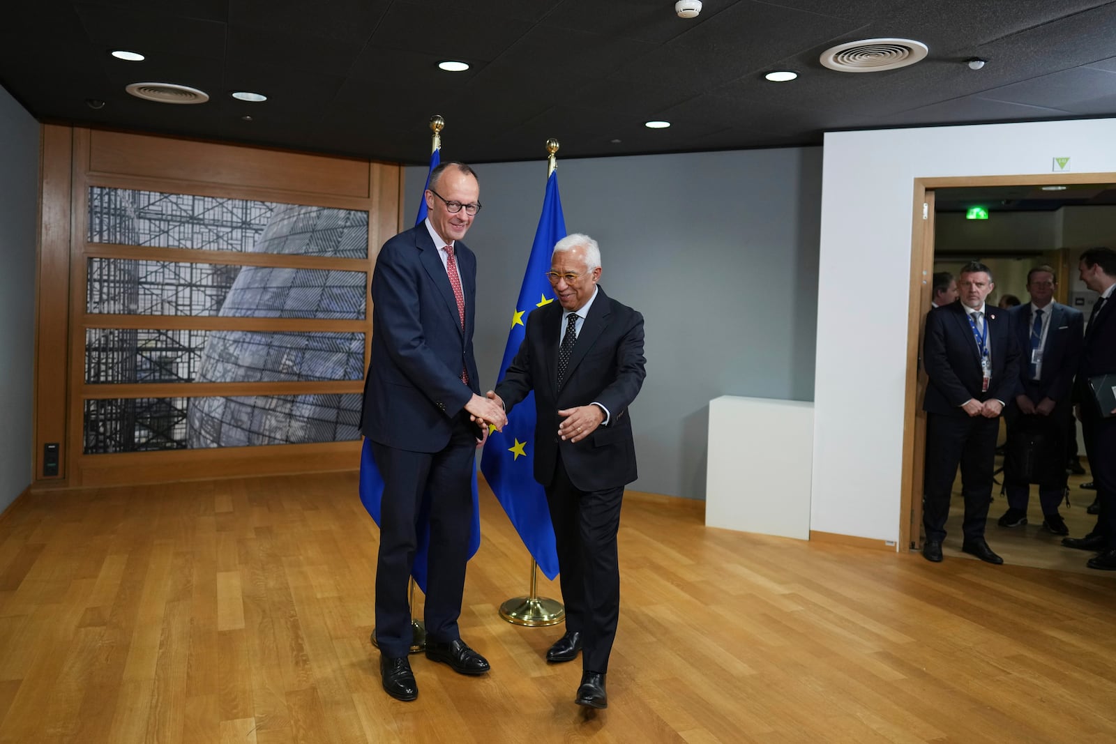 European Council President Antonio Costa, right, greets Friedrich Merz, leader of the Christian Democratic Union, prior to a meeting at the European Council building in Brussels, Thursday, March 6, 2025. (AP Photo/Virginia Mayo)