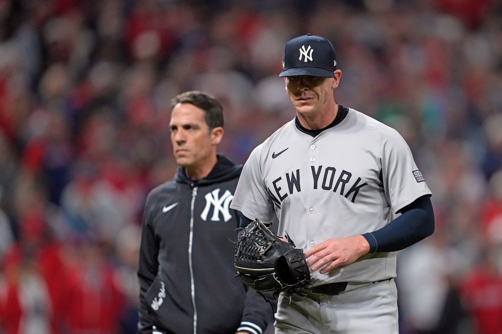 New York Yankees relief pitcher Ian Hamilton leaves during the sixth inning in Game 3 of the baseball AL Championship Series against the Cleveland Guardians Thursday, Oct. 17, 2024, in Cleveland.(AP Photo/Godofredo Vásquez )