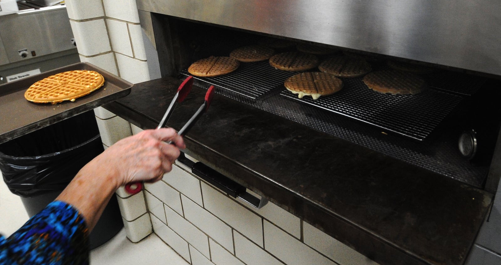 Waffles are kept fresh and hot to keep up wth demand for orders at the Waffle Shop Tuesday, Nov. 15, 2022, at the Christ Episcopal Church. MARSHALL GORBY\STAFF