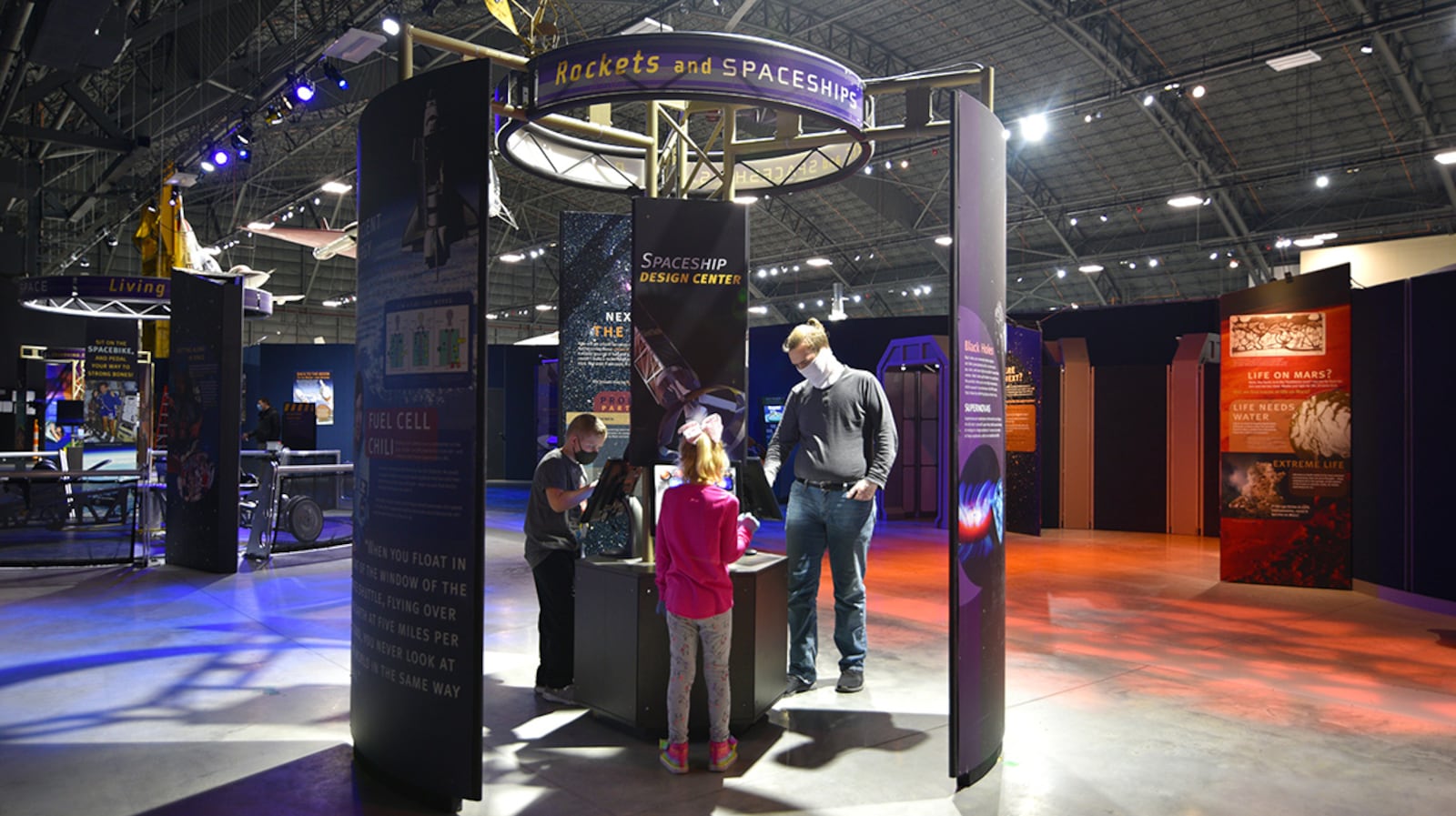 (From left) Levi and, Laney Daniel, along with their uncle, Ben Thomas, try their hand at designing spacecraft in the National Museum of the U.S. Air Force’s newest temporary exhibit, “Space: A Journey to Our Future.” The exhibit opened Jan. 28 and closed Sept. 6. U.S. AIR FORCE PHOTO/KEN LAROCK