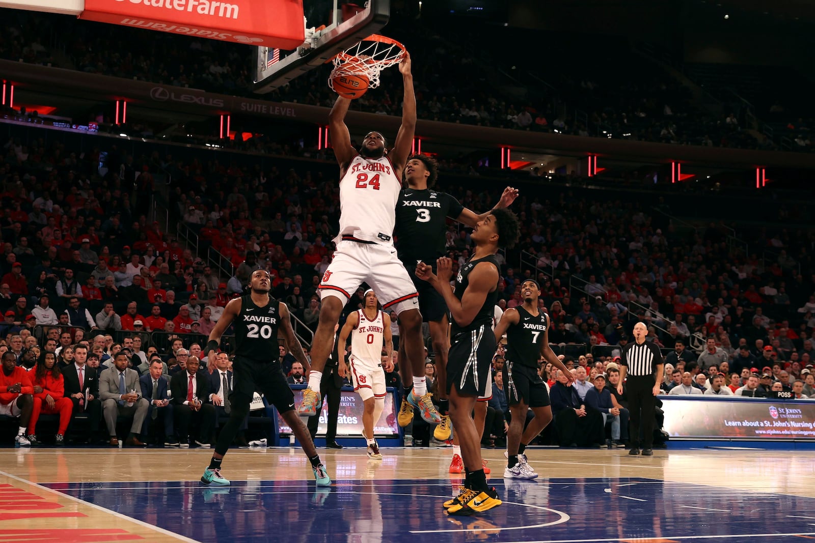 St. John's forward Zuby Ejiofor (24) dunks the ball during the second half of an NCAA college basketball game against Xavier, Wednesday, Jan. 22, 2025, in New York. (AP Photo/Pamela Smith)