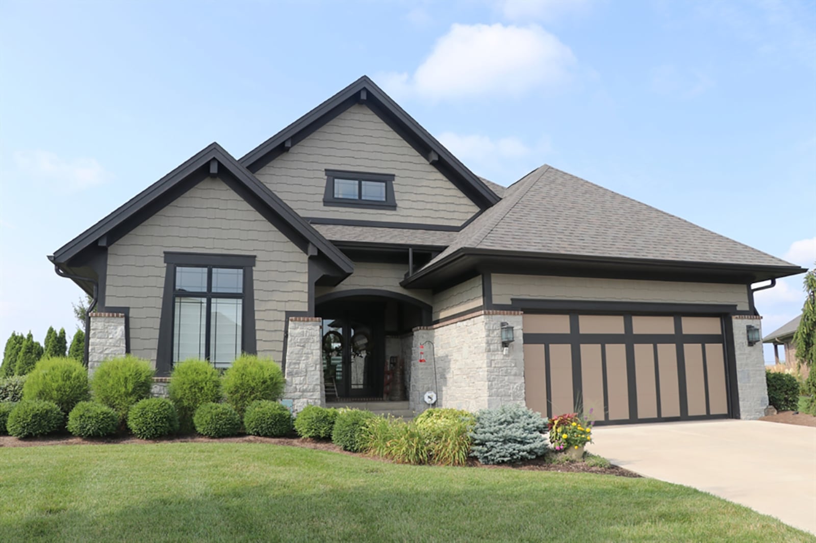 The stone-and-Hardieplank ranch has about 3,410 sq. ft. of living space, including the finished lower level with egress and above-grade windows. The house is located within the Liberty Hill section of the Stonehill Village of Beavercreek Twp. where residents have use of two swimming pools, fitness center, tennis courts and walking trails. CONTRIBUTED PHOTO BY KATHY TYLER