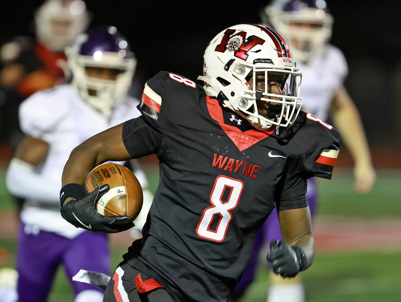 Wayne's Jamier Averette-Brown carries the ball against Middletown during Friday's game. BILL LACKEY/STAFF