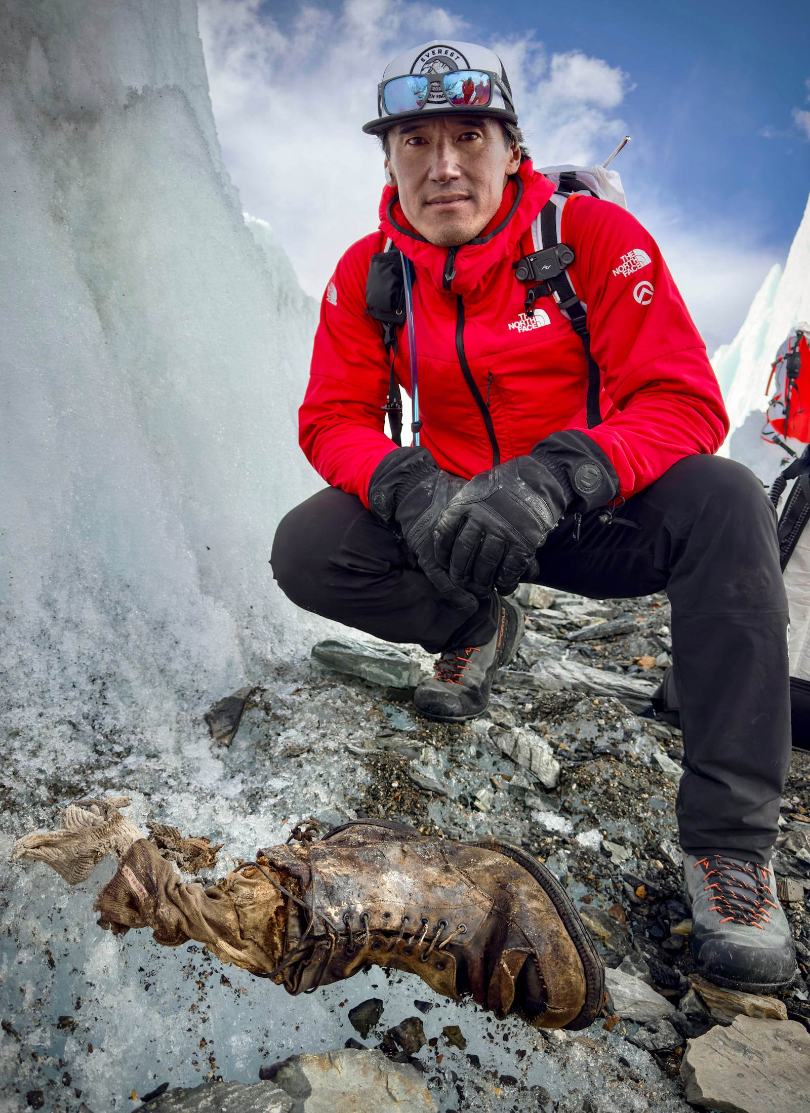 In this photo provided by National Geographic on Friday, Oct. 11, 2024, a view of a sock embroidered with "A.C. Irvine", along with a boot, discovered on the Central Rongbuk Glacier below the North Face of Mount Everest by a team led by Jimmy Chin. (Jimmy Chin/National Geographic via AP)