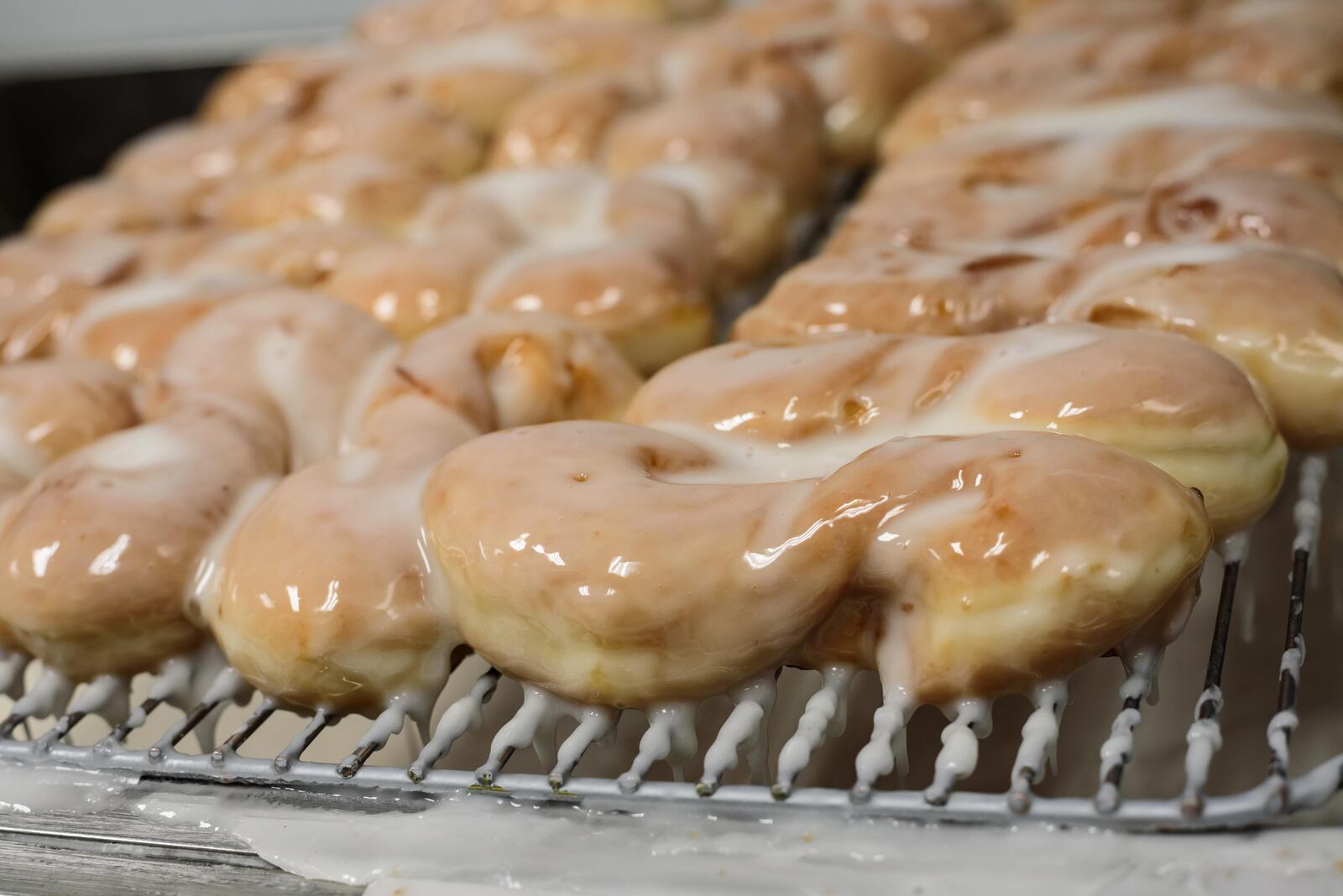  Bear Creek Donuts in Miamisburg and The Donut Haus Bakery in Springboro offering one free doughnut with any purchase of a dozen donuts on National Doughnut Day, June 4, 2021. TOM GILLIAM / CONTRIBUTING PHOTOGRAPHER