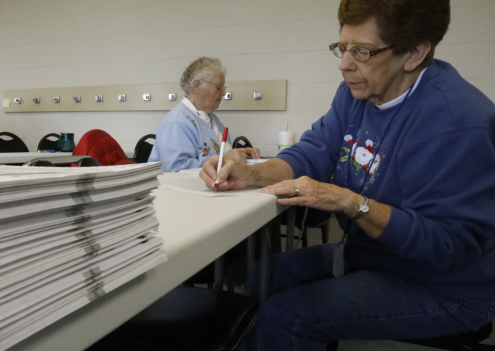 In this photo taken after the 2016 election Betty Prosser and Lois Grashel count ballots by hand during thepost-election audit at the Clark County Board of Elections. Bill Lackey/Staff