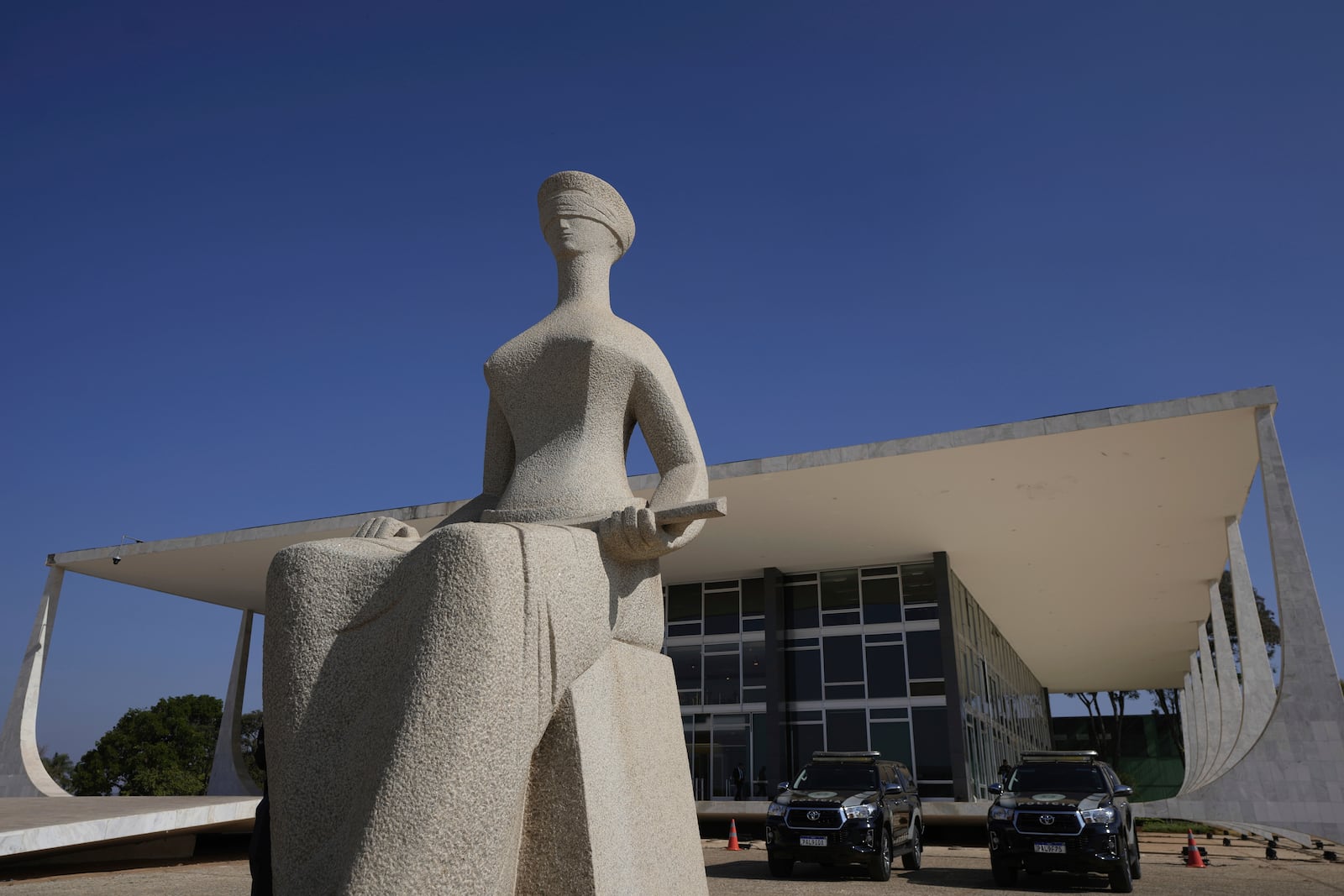 FILE - Lady Justice statue, depicting a seated, blindfolded woman holding a sword, stands outside the Supreme Court in Brasilia, Brazil, Sept. 2, 2024. (AP Photo/Eraldo Peres, File)