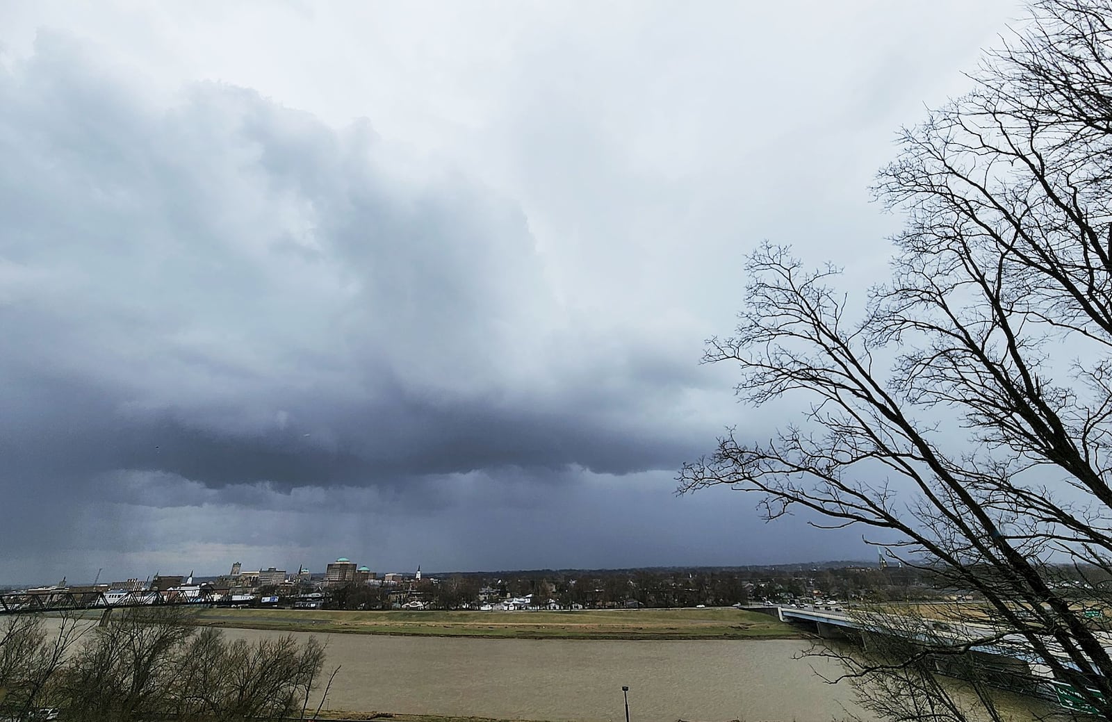 Dark clouds could be seen in Hamilton while Butler County was under a severe thunderstorm warning Wednesday afternoon, March 23, 2022, for a line of strong storms that moved through the region. NICK GRAHAM / STAFF