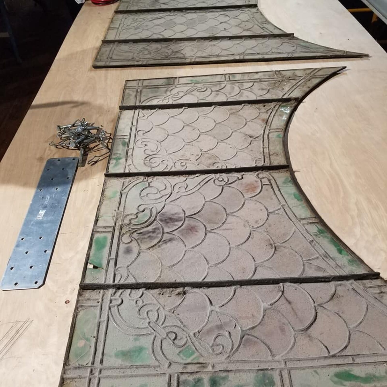 The Century Bar began posting progress photos at its new location on Facebook after closing following a New Year's Eve bash.   This photo posted January 5, 2020 shows one of the bar's stain glass panels before it was cleaned.