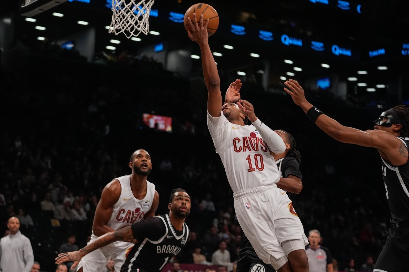 Cleveland Cavaliers' Darius Garland (10) drives past Brooklyn Nets' D'Angelo Russell (1) during the first half of an NBA basketball game Thursday, Feb. 20, 2025, in New York. (AP Photo/Frank Franklin II)