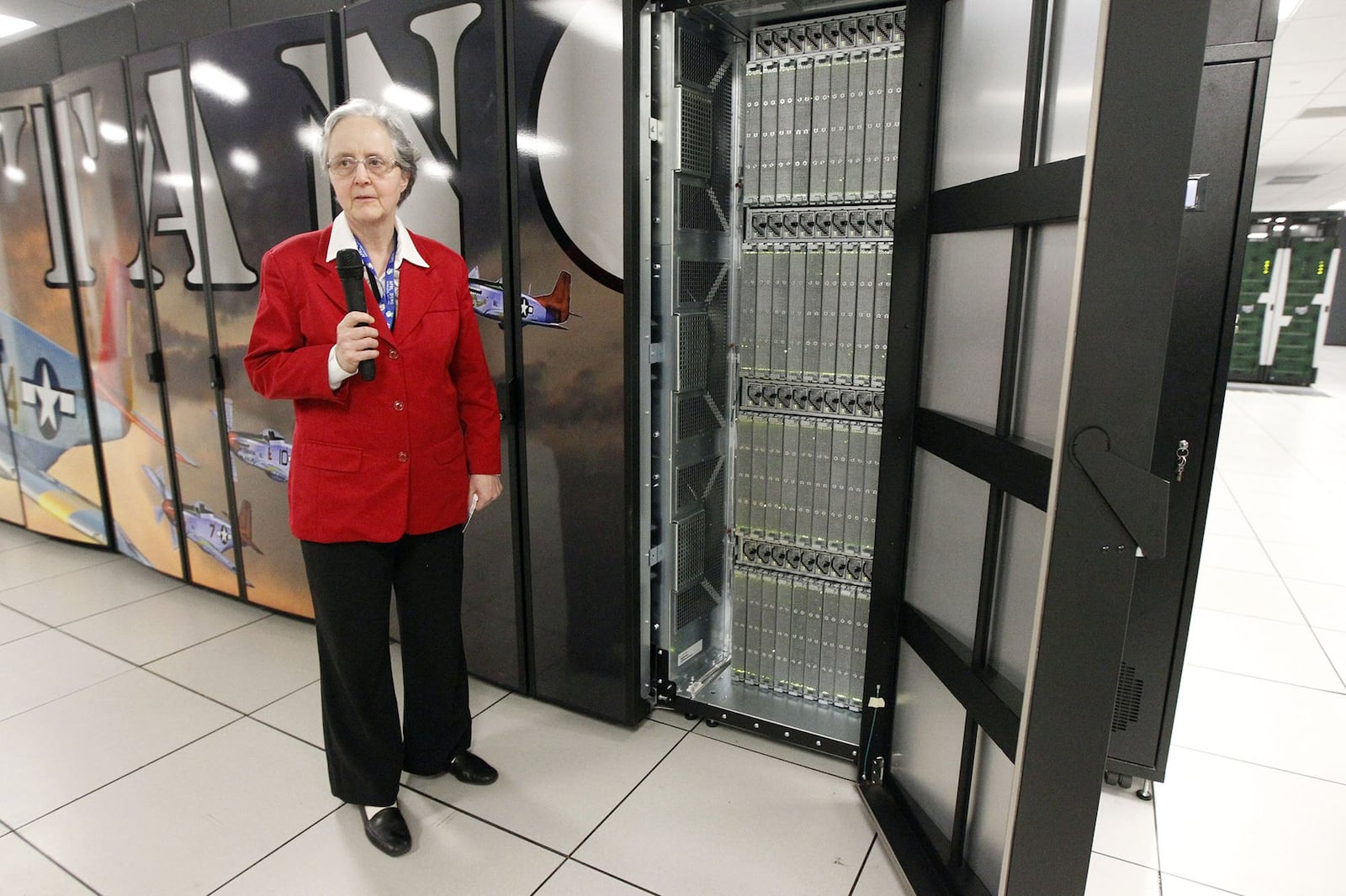 Four new supercomputers were unveiled at Wright-Patterson Air Force Base on Tuesday by the Air Force Research Lab’s Defense Supercomputing Resource Center (DSRC). This unclassified supercomputer named for the WWII era P-51 Mustang was described by Virginia Ross, Ph.D. senior computer engineer, AFRL, DSRC. The huge computing machine has 56,448 computing cores and is cooled with water. TY GREENLEES / STAFF