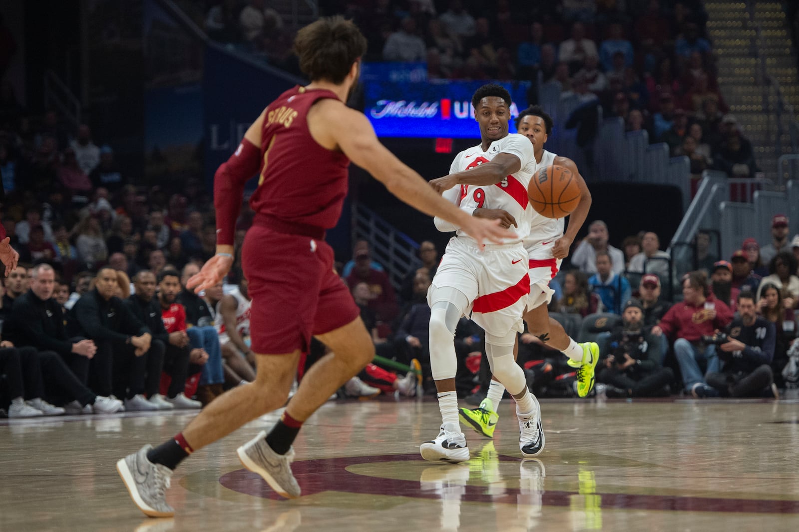 Toronto Raptors' RJ Barrett (9) loses his grip on the ball as Cleveland Cavaliers' Cleveland Cavaliers' Max Strus,left, moves in during the first half of an NBA basketball game in Cleveland, Thursday, Jan. 9, 2025. (AP Photo/Phil Long)