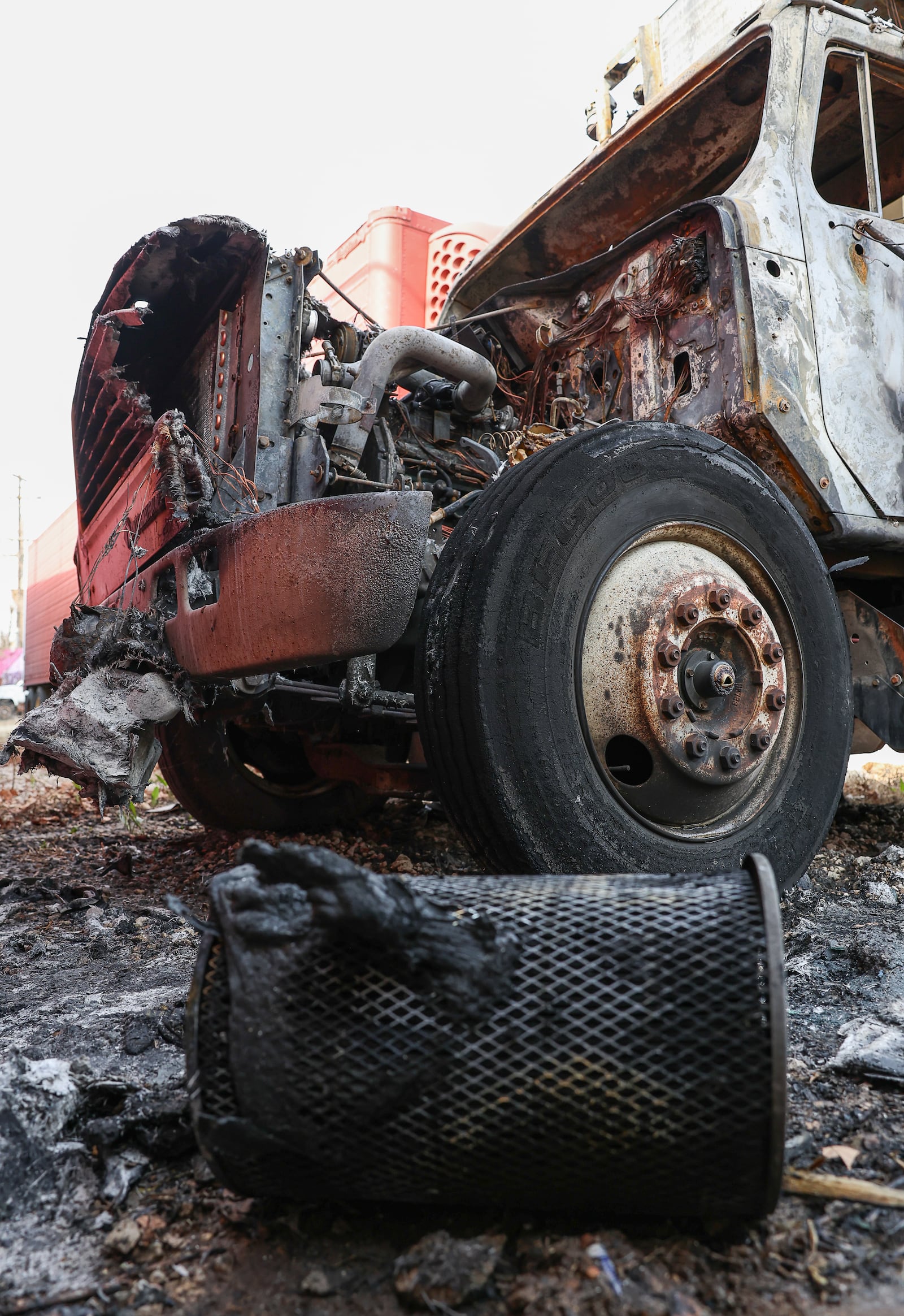 A truck at With God's Grace food pantry in Dayton caught fire shortly before sunrise on Wednesday morning. Nicole Adkins, the pantry's executive director, said two makes were seen leaving the area on a bicycle and skateboard. BRYANT BILLING / STAFF