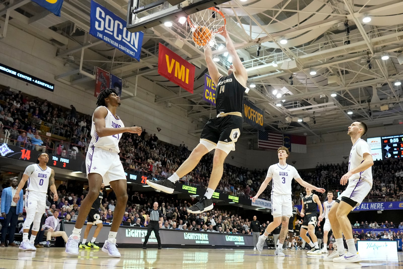 Wofford center Kyler Filewich dunks against Furman during the first half of an college basketball championship game at the Southern Conference tournament, Monday, March 10, 2025, in Asheville, N.C. (AP Photo/Chris Carlson)