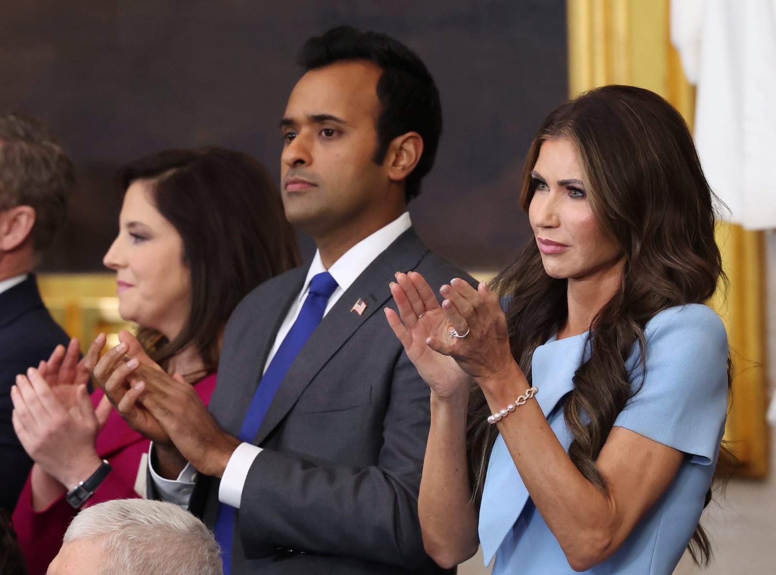 Rep. Elise Stefanik, R-N.Y., from left, Vivek Ramaswamy and South Dakota Gov. Kristi Noem listen as President Donald Trump speaks after taking the oath of office at the 60th Presidential Inauguration in the Rotunda of the U.S. Capitol in Washington, Monday, Jan. 20, 2025. (Kevin Lamarque/Pool Photo via AP)