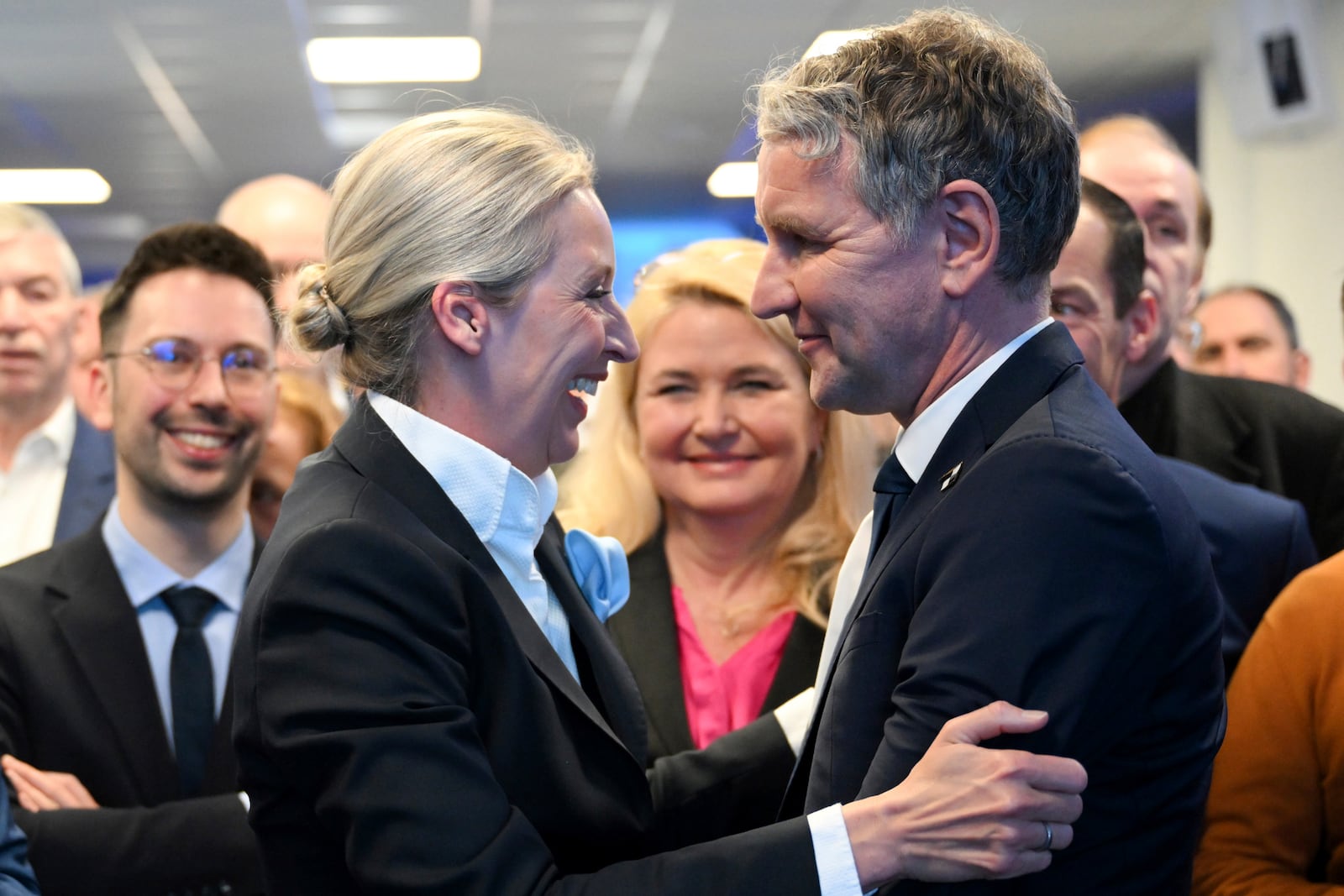 Alice Weidel, co-leader of the Alternative for Germany (AfD), hugs the party member Bjoern Hoecke during the election party at the party's headquarters in Berlin Germany, Sunday, Feb. 23, 2025. (Soeren Stache/DPA via AP, Pool)