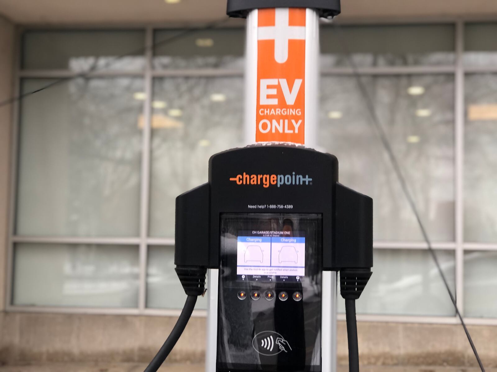 An electric vehicle charging station in downtown Dayton. CORNELIUS FROLIK / STAFF