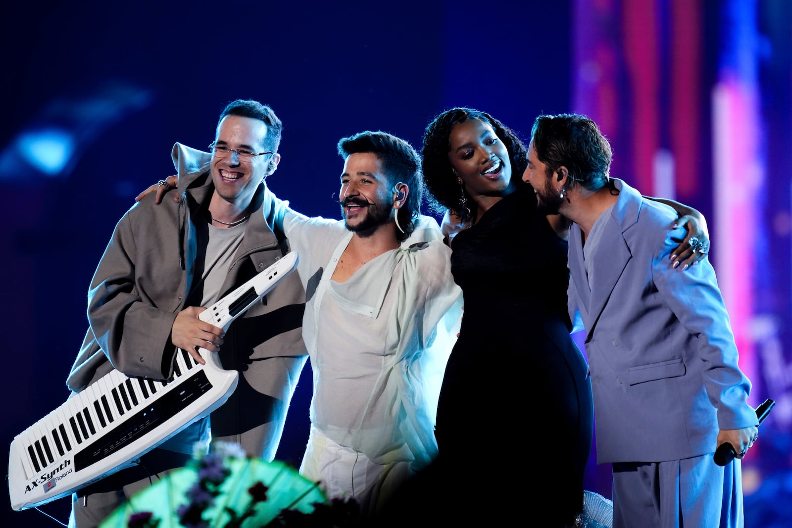 FILE - Producer and songwriter Edgar Barrera, from left, Camilo, IZA, and Manuel Carrasco perform during the 24th Annual Latin Grammy Awards, in Seville, Spain, Nov. 16, 2023. (Photo by Jose Breton/Invision/AP File)