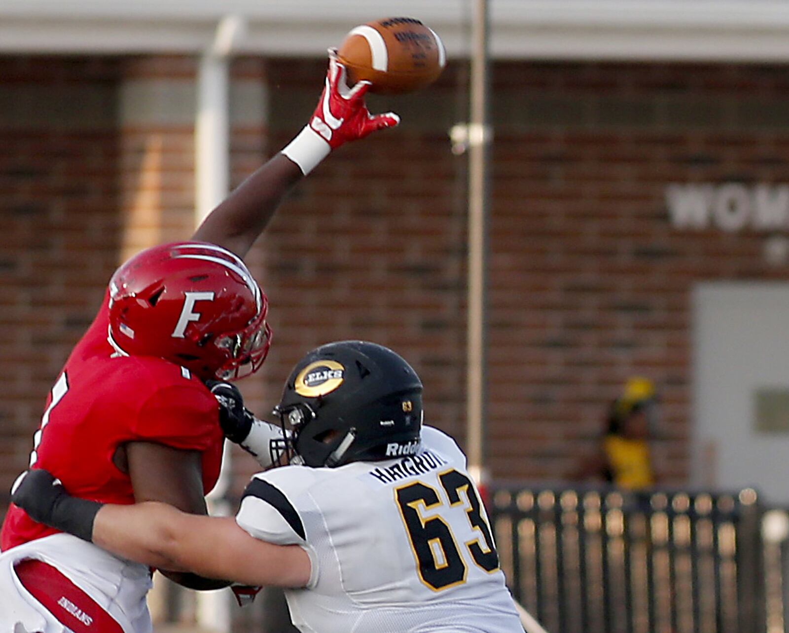 Fairfield defensive lineman Malik Vann gets past Centerville offensive lineman Greg Hargrove to knock down a pass Friday night at Fairfield Stadium. The visiting Elks won 30-23 in the Skyline Chili Crosstown Showdown. CONTRIBUTED PHOTO BY E.L. HUBBARD