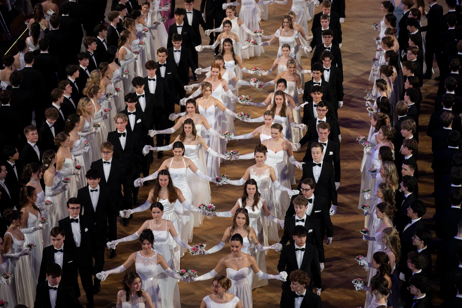 Around 700 young people opened the Elmayer-Kränzchen this year, a Traditional Ball of the Elmayer Dance School in Vienna, Austria, Tuesday, March 4, 2025. (AP Photo/Denes Erdos)