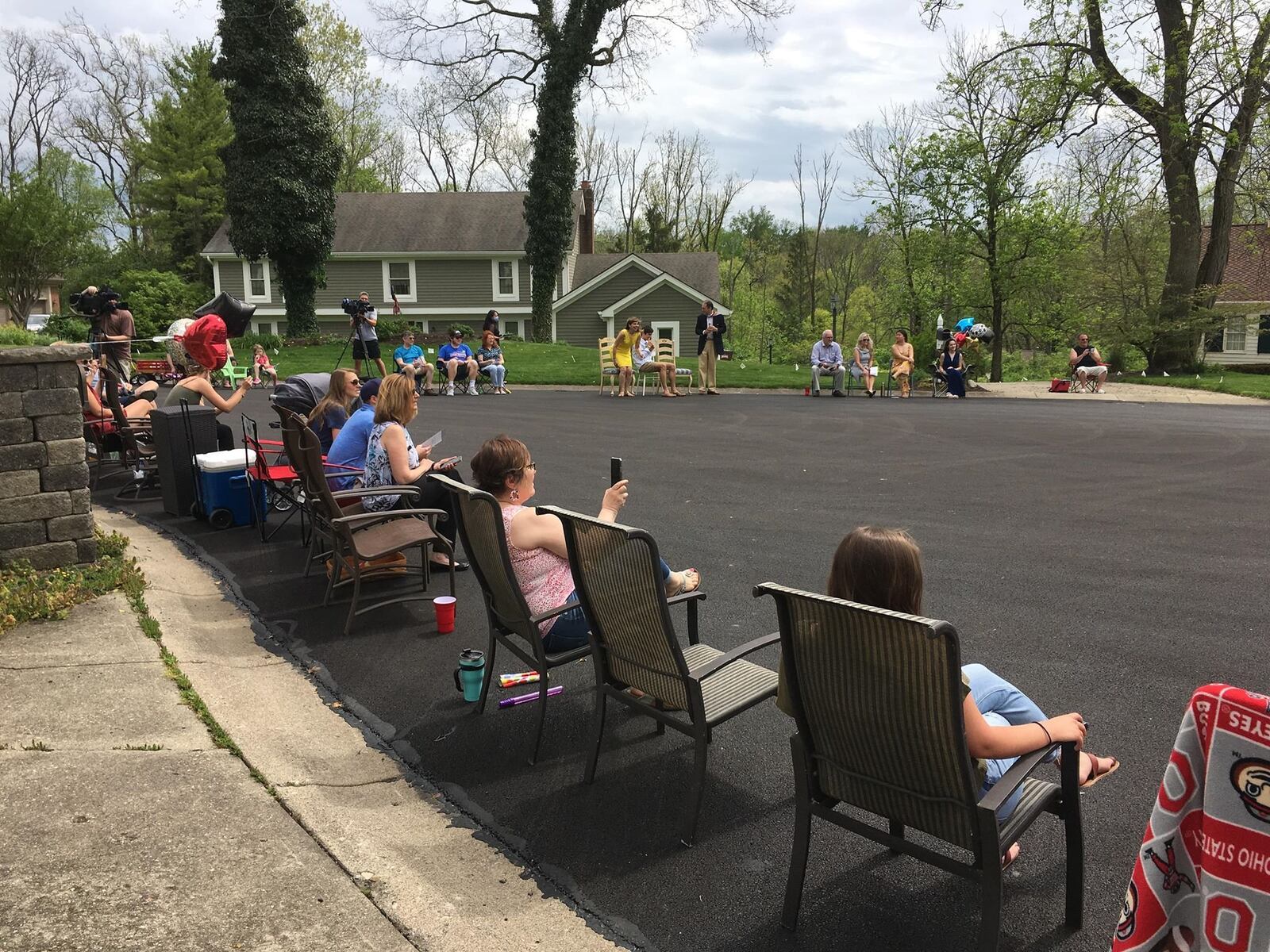 Neighbors of Southbridge Lane in Washington Twp. gathered for a graduation ceremony of 5 graduates who live on the street on Saturday, May 16, 2020. Staff Photo / Sarah Franks