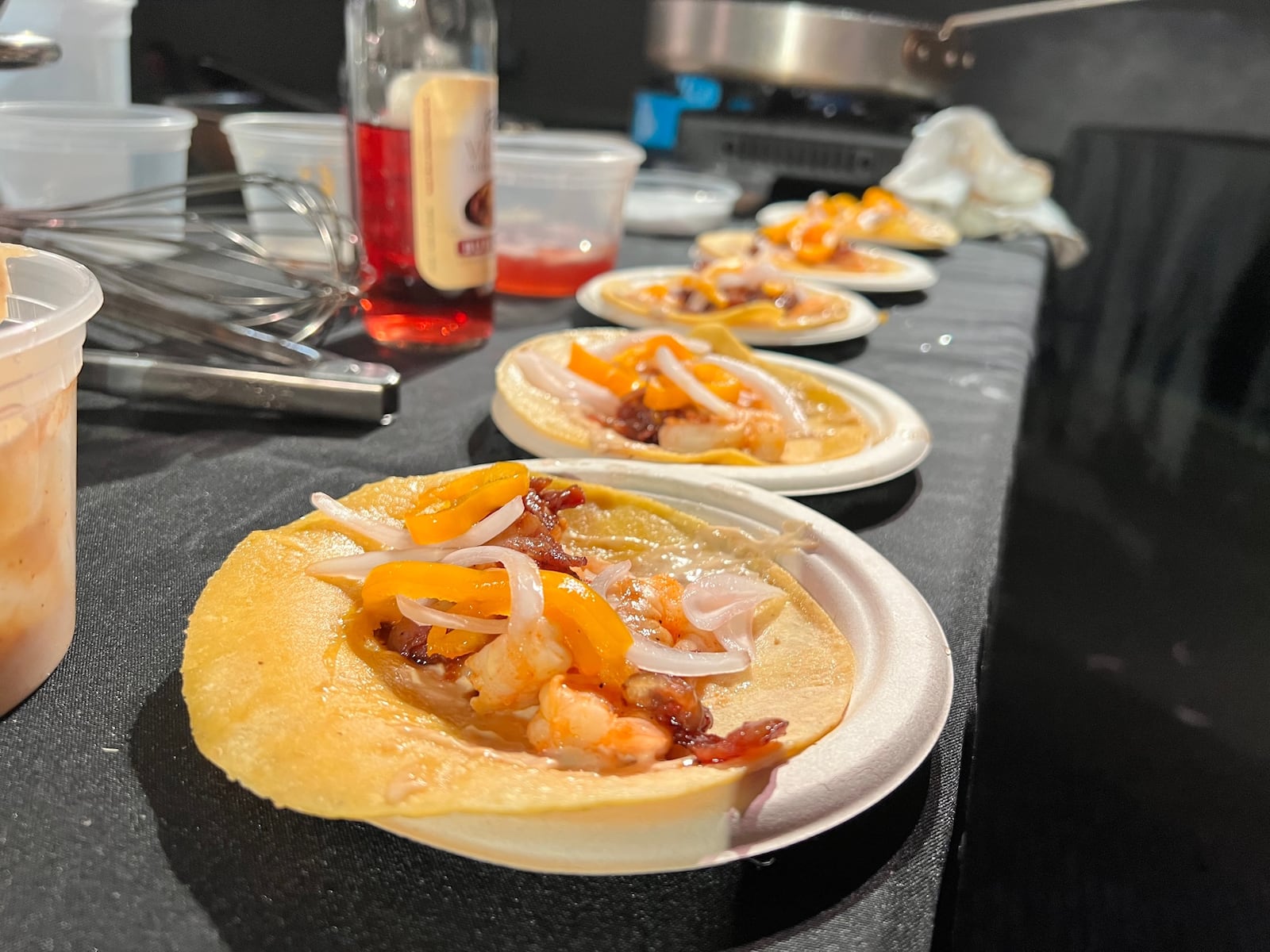 Katy Evans, Executive Chef of Coldwater Cafe participates in the Diced Dayton Chef's Challenge at the Brightside Music Venue, pictured are her shrimp street taco with bacon jam, pickled onions and peppers, and a garlic chipotle aioli