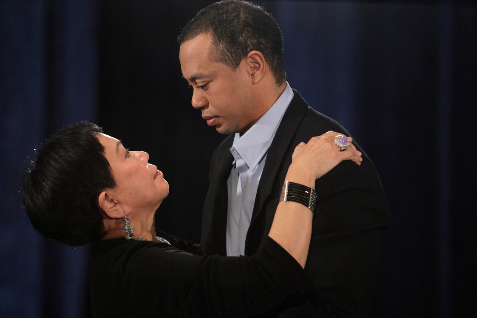 Tiger Woods, hugs his mother, Kultida Woods, during a news conference, Friday, Feb. 19, 2010, in Ponte Vedra Beach, Fla. (AP Photo/Eric Gay, File)