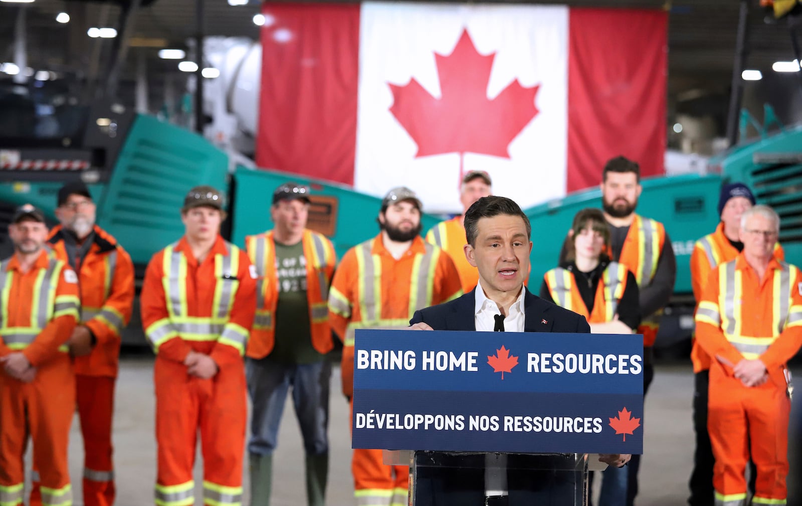 Conservative Leader Pierre Poilievre addresses the crowd at Pioneer Construction in Sudbury, Ont. on Wednesday March 19, 2025. (Gino Donato /The Canadian Press via AP)