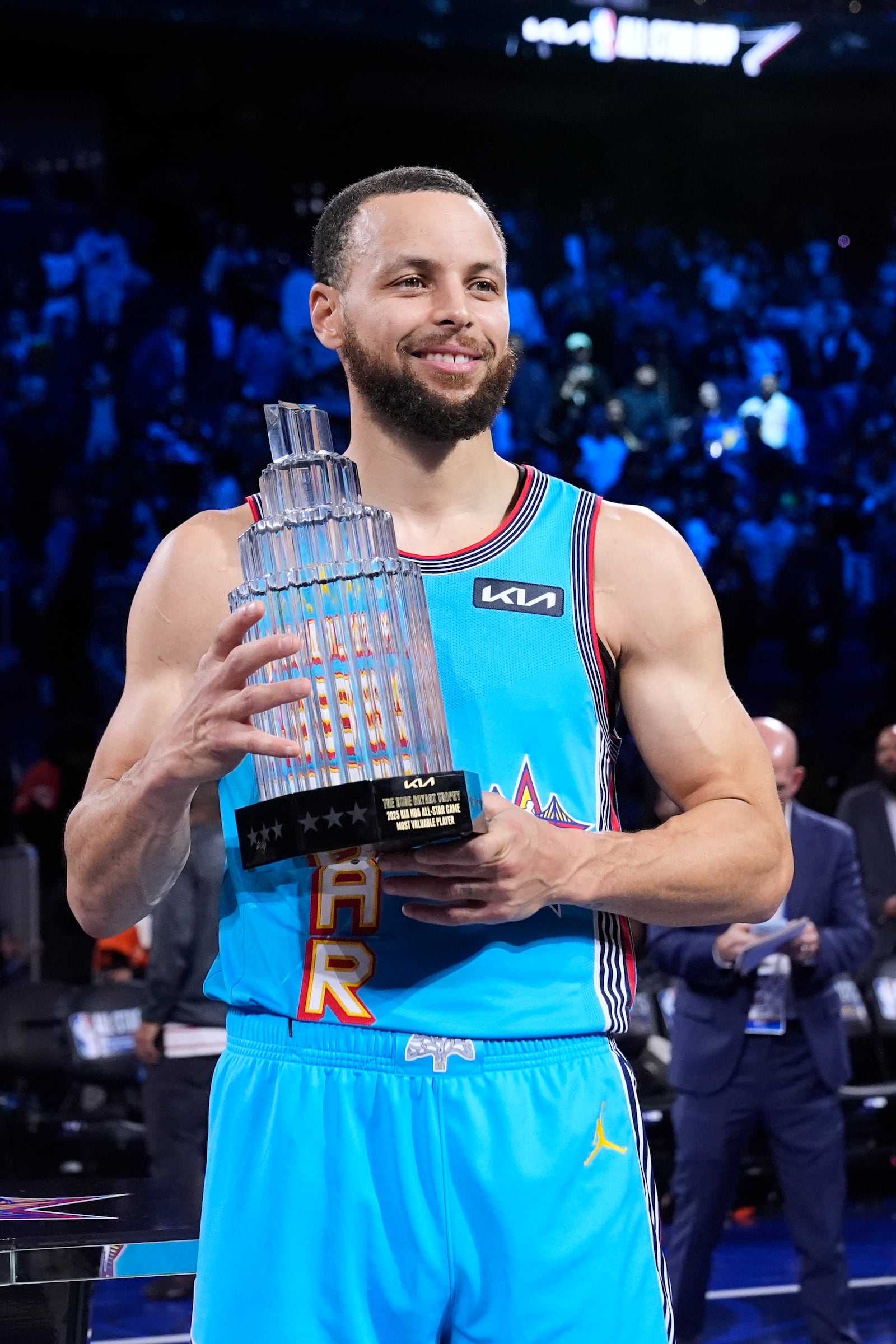 Golden State Warriors guard Stephen Curry holds the Most Valuable Player trophy after the NBA All-Star basketball game Sunday, Feb. 16, 2025, in San Francisco. (AP Photo/Godofredo A. Vásquez)