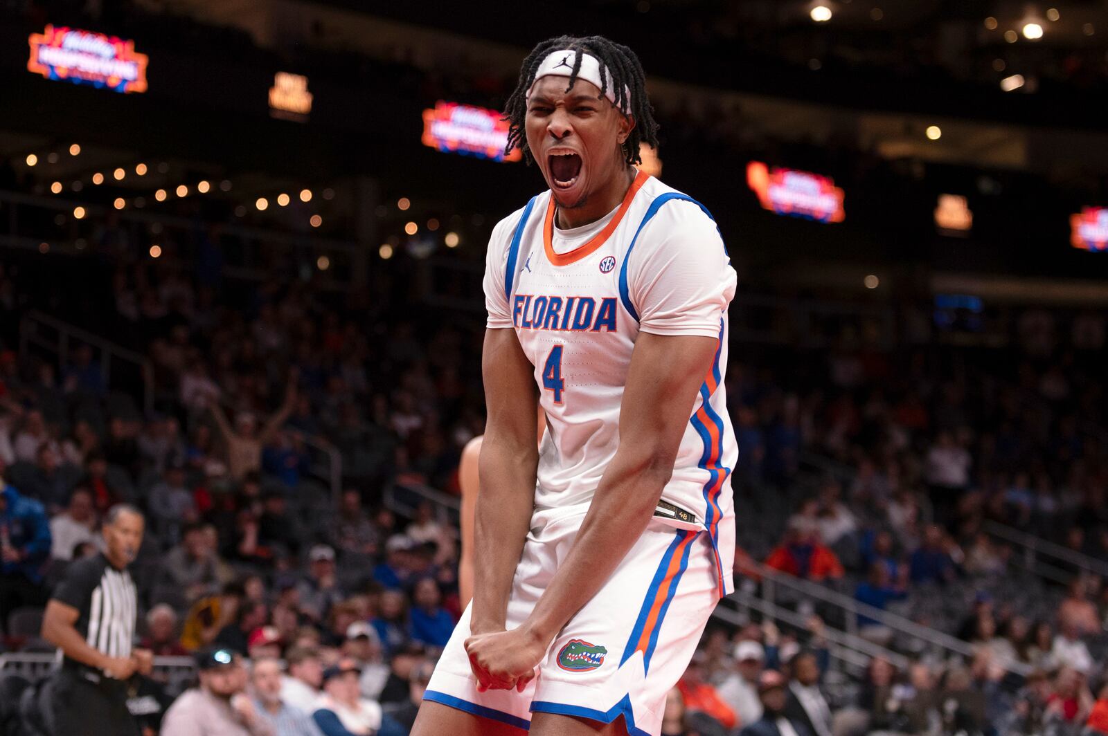 Florida forward Sam Alexis (4) celebrate his dunk during the second half of an NCAA college basketball game against Arizona State on Saturday, Dec. 14, 2024, in Atlanta. (AP Photo/Kathryn Skeean)