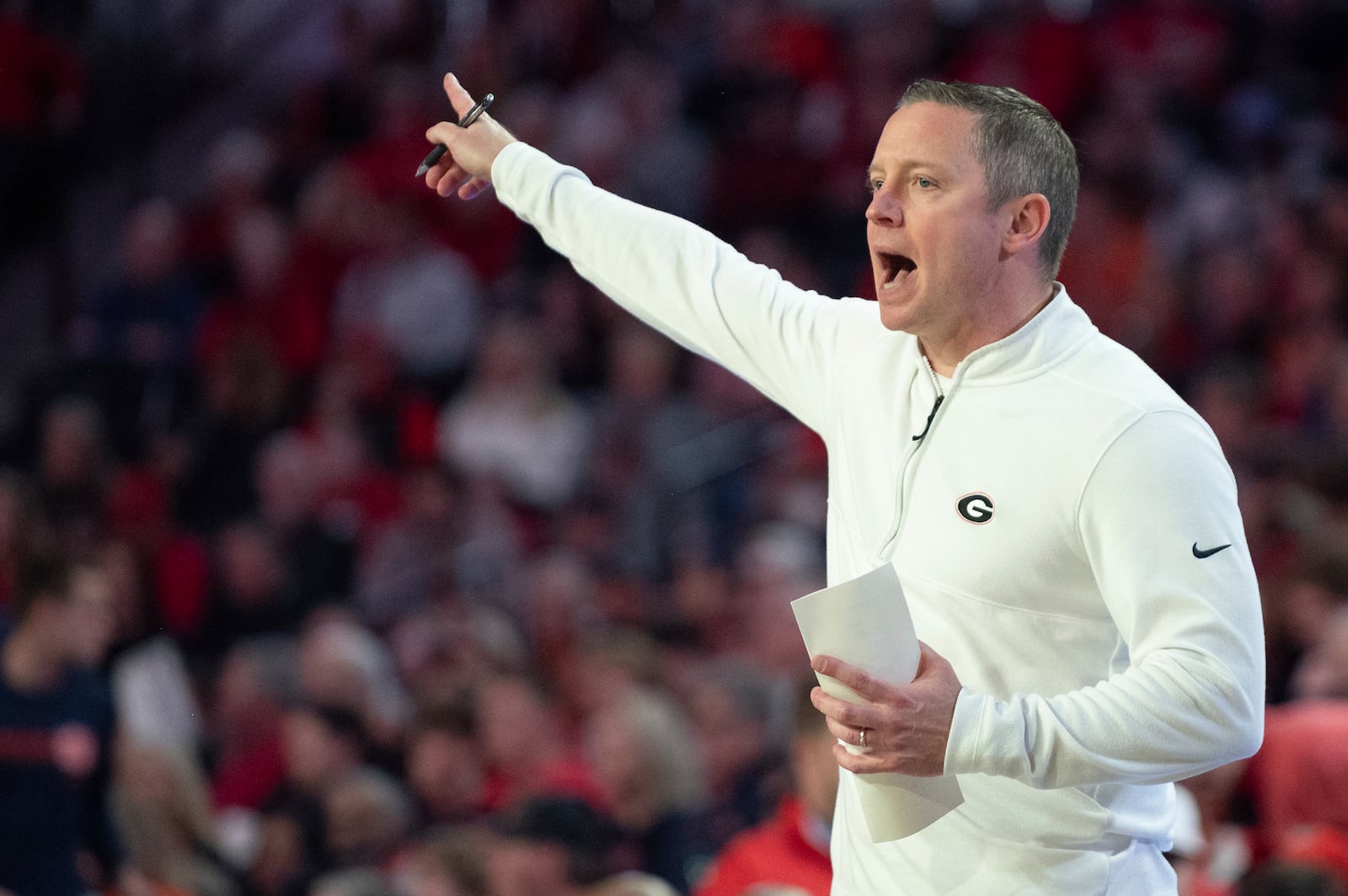 Georgia head coach Mike White directs his players during the first half of an NCAA college basketball game against Auburn, Saturday, Jan. 18, 2025, in Athens, Ga. (AP Photo/Kathryn Skeean)