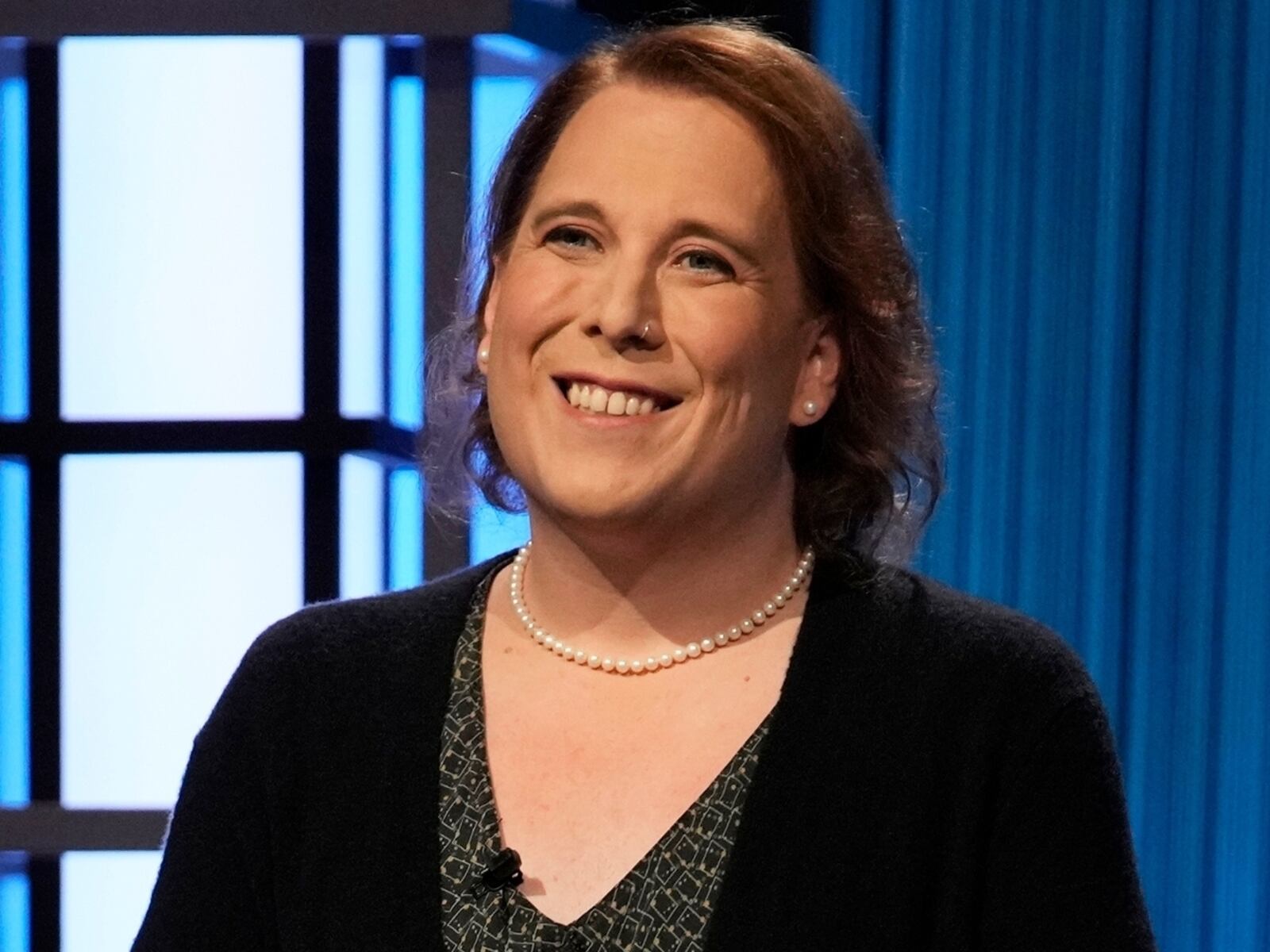 This image provided by Jeopardy Productions, Inc. shows game show champion Amy Schneider on the set of "Jeopardy!" Schneider is the first trans person to qualify for the show's Tournament of Champions. (Jeopardy Productions, Inc. via AP)