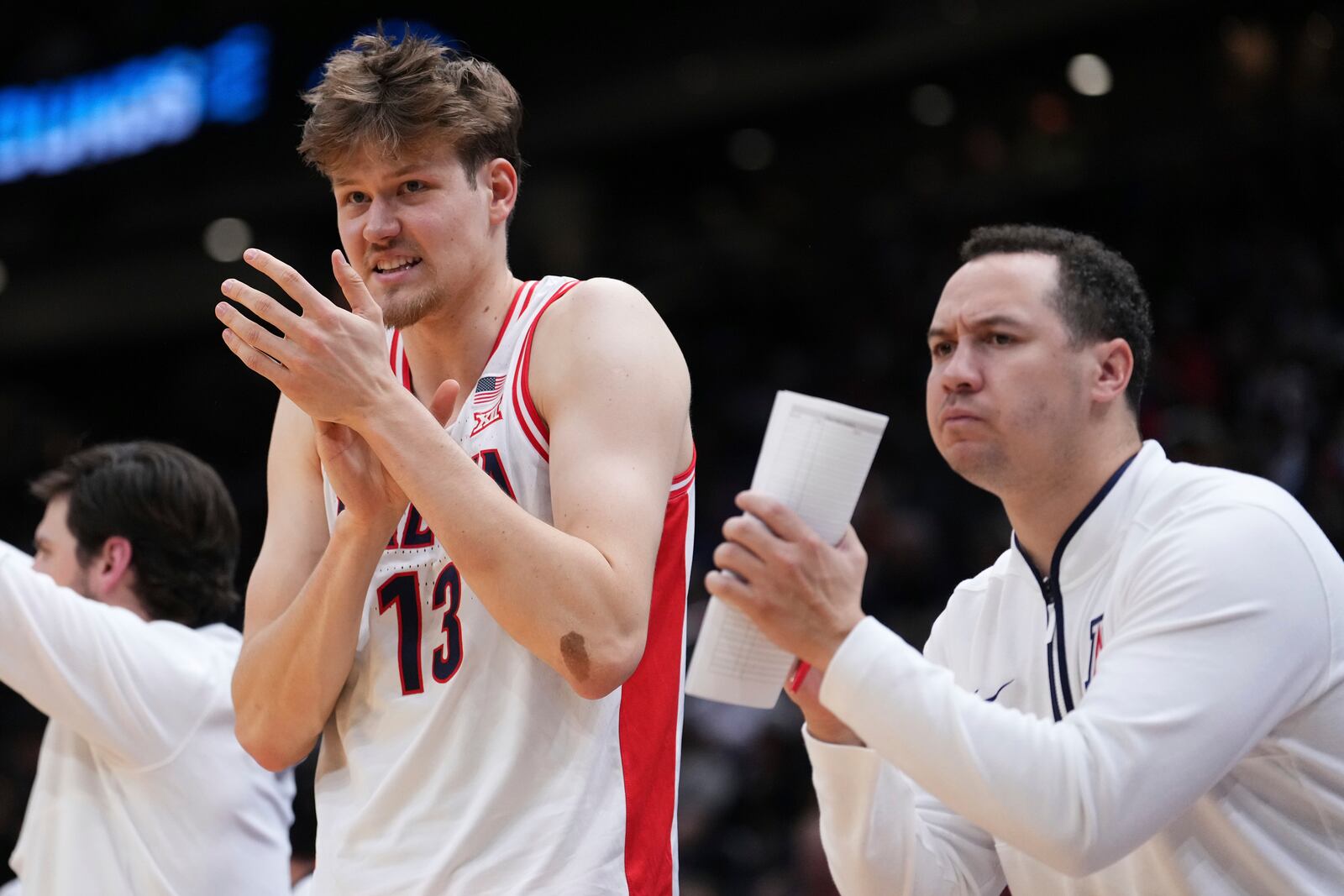 Arizona forward Henri Veesaar claps on the bench during the second half against Oregon in the second round of the NCAA college basketball tournament, Sunday, March 23, 2025 in Seattle. (AP Photo/Lindsey Wasson)