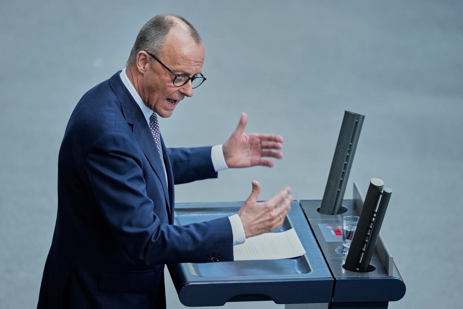 German opposition leader and Christian Democratic Union party chairman Friedrich Merz, right, speaks during a debate and voting about loosen the country's debt rules and change constitution in the German Parliament Bundestag in Berlin, Germany, Tuesday, March 18, 2025. (AP Photo/Ebrahim Noroozi)