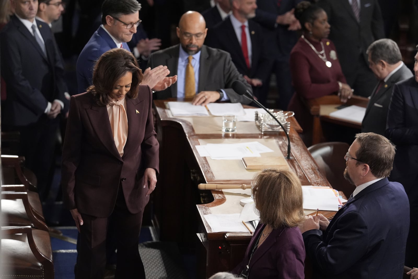 Vice President Kamala Harris walks off the dais in the House Chamber after she announced President-elect Donald Trump had won the presidential election, Monday, Jan. 6, 2025, at the U.S. Capitol in Washington, as Speaker of the House Mike Johnson applauds and looks on. (AP Photo/J. Scott Applewhite)