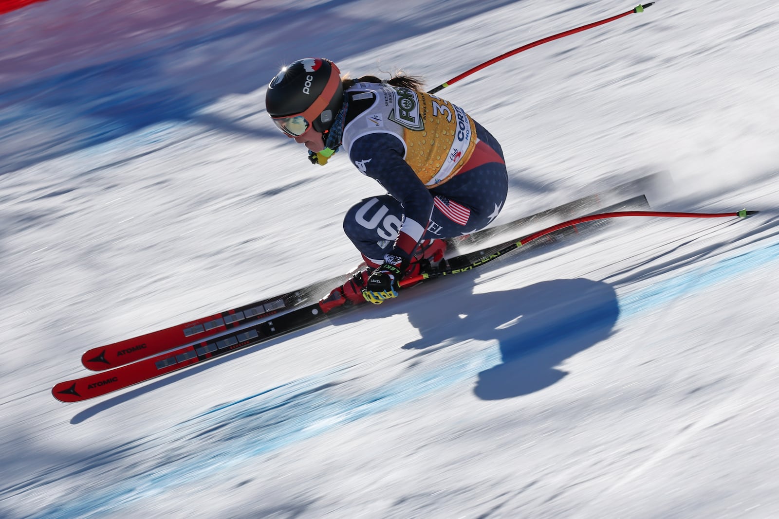 United States' Breezy Johnson speeds down the course during an alpine ski, women's World Cup downhill training, in Cortina d'Ampezzo, Italy, Friday, Jan. 17, 2025. (AP Photo/Marco Trovati)