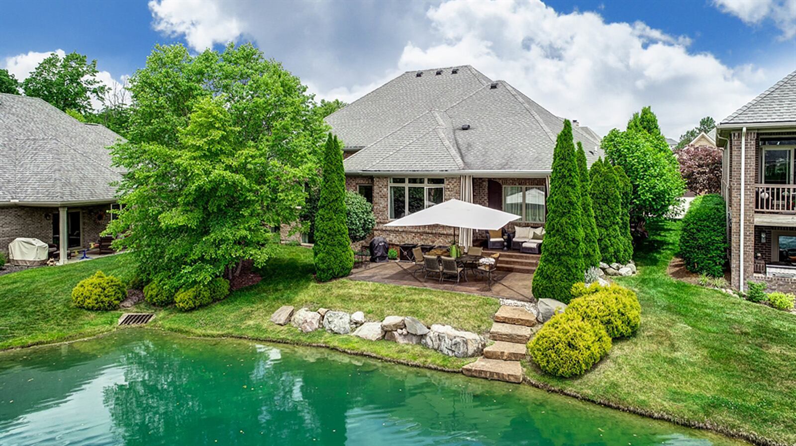 The morning room has a peaked tray ceiling with a chandelier, triple windows with transoms and a single door that opens out to the covered rear porch. The home features a floor plan that allows for picturesque views of a fountain and pond from nearly every room. CONTRIBUTED PHOTO