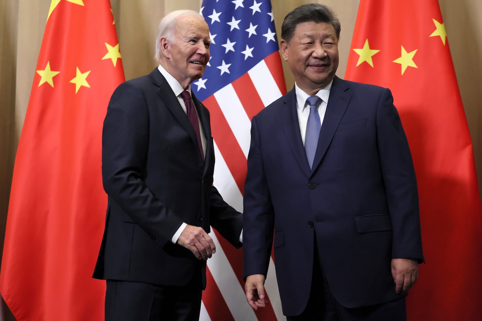 FILE - President Joe Biden, left, and Chinese President Xi Jinping before a bilateral meeting on Nov. 16, 2024, in Lima, Peru. (Leah Millis/Pool Photo via AP, File)