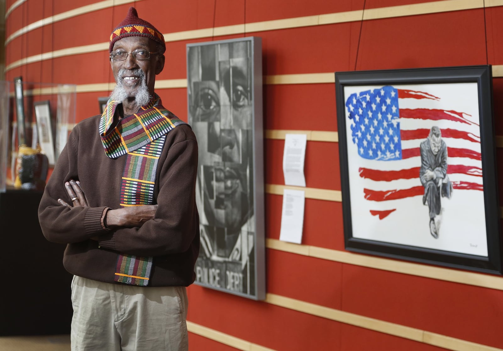 Willis “Bing” Davis is the curator of the 2018 Visual Voices art exhibit, “The Preacher, The Poet, The Vision.” Artists were tasked with commemorating Dr. Martin Luther King, Jr. through the literary voice of Dayton poet Paul Laurence Dunbar. The display can be seen in the Wintergarden at the Schuster Center in Dayton. LISA POWELL / STAFF