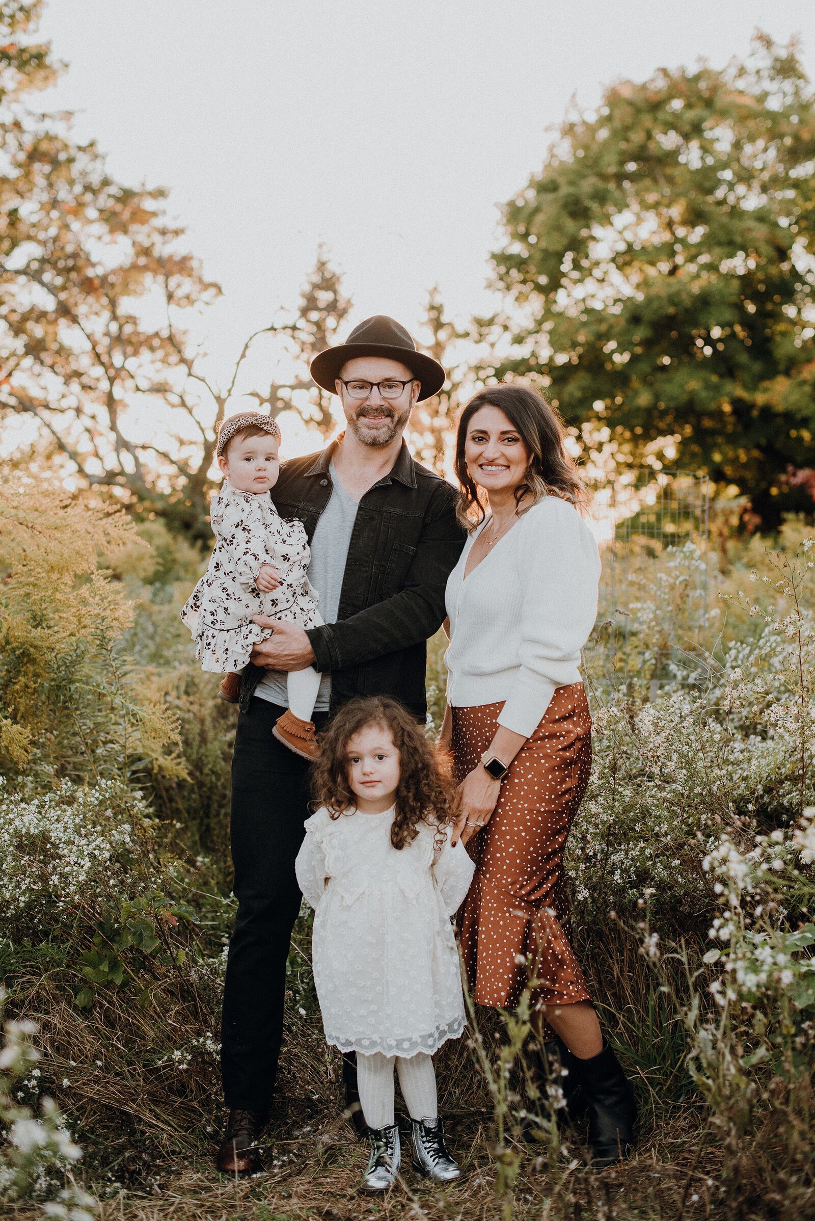 Reena Goodwin (Right) with her family. Jody (husband (back left) holding daughter Elodie and Simone (Front). The family enjoys living in Warren County because of its proximity to major cities and opportunities for family activities.