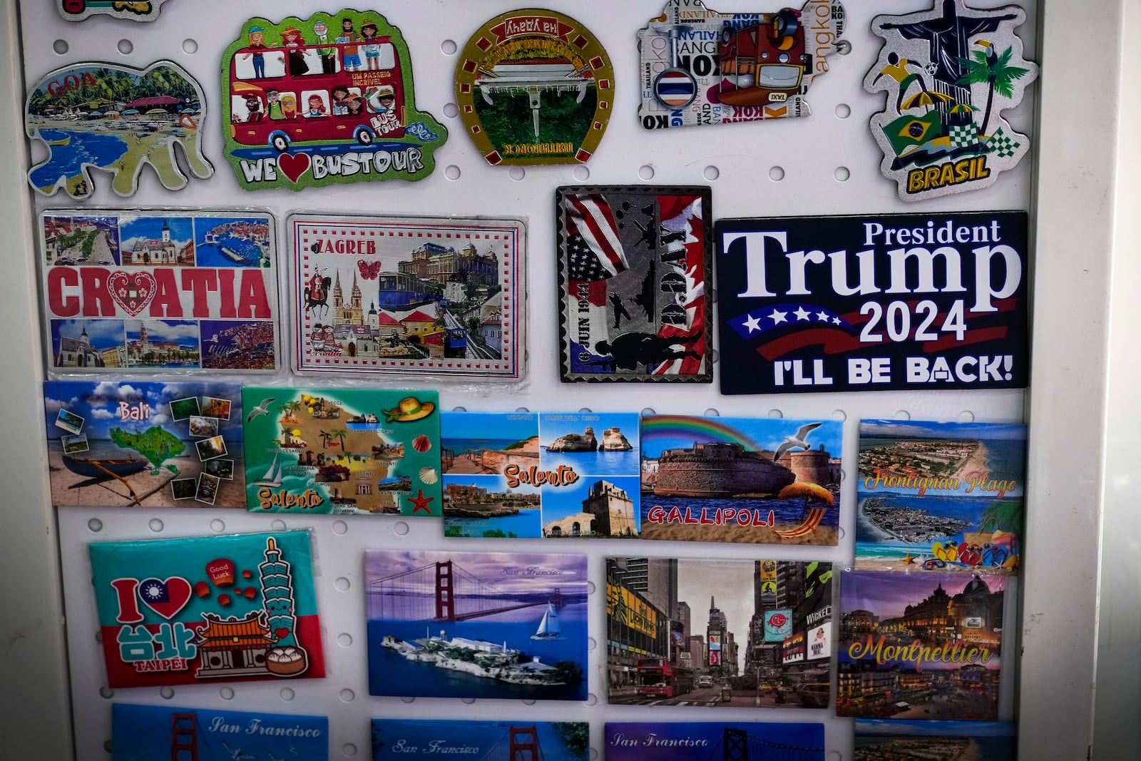 A fridge magnet that reads "President Donald Trump 2024" is displayed at a store at the Yiwu wholesale market in Yiwu, east China's Zhejiang province, Nov. 8, 2024. (AP Photo/Andy Wong)