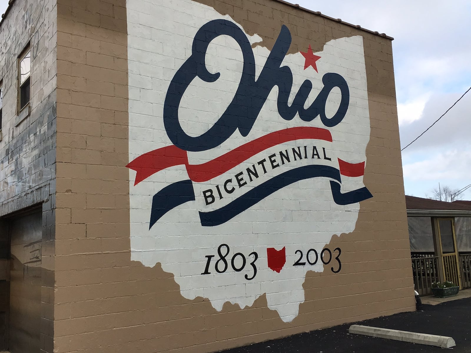 Ohio Bicentennial logo mural that is on the back of a building at the corner of South Main and East Sixth streets in Franklin was recently retouched. Artist Eric Henn, who originally painted the city’s seven murals, was hired by the city to retouch the murals which had faded or was peeling. During the state’s bicentennial year, Henn was commissioned to paint one of these logos on a barn in each of Ohio’s 88 counties. The logo in Franklin was the 89th that he painted. ED RICHTER/STAFF