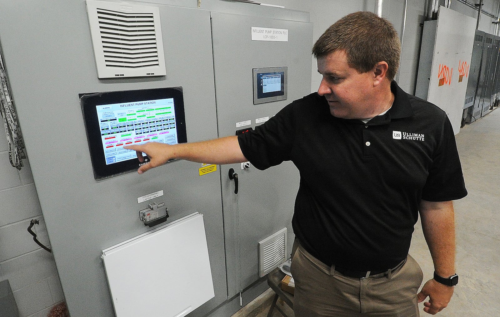 Project manager Ben Simcik, of Ulliman Schutte, points out technology that measures and monitors the flow of water at Montgomery County facilities. The upgraded monitoring system is a part of a $65 million sewer modernization project that unveiled on June 5, 2024. MARSHALL GORBY\STAFF