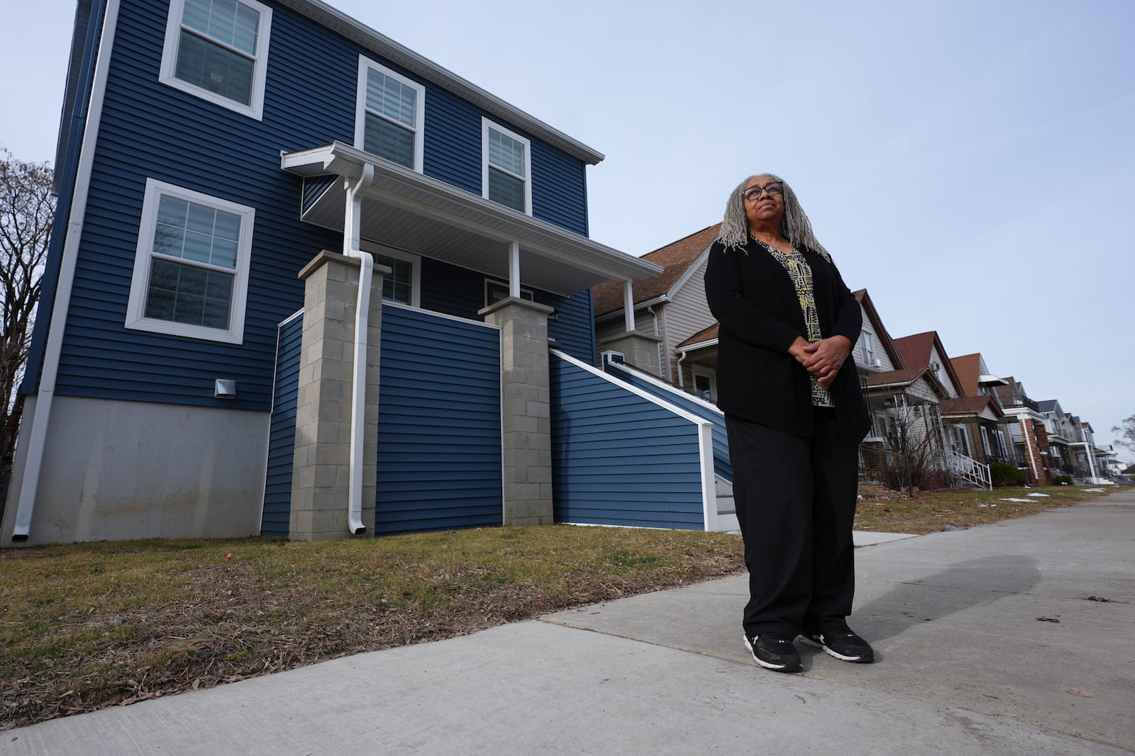 Leslie Knox stands outside her home Wednesday, Feb. 5, 2025, in Hamtramck, Mich. (AP Photo/Paul Sancya)