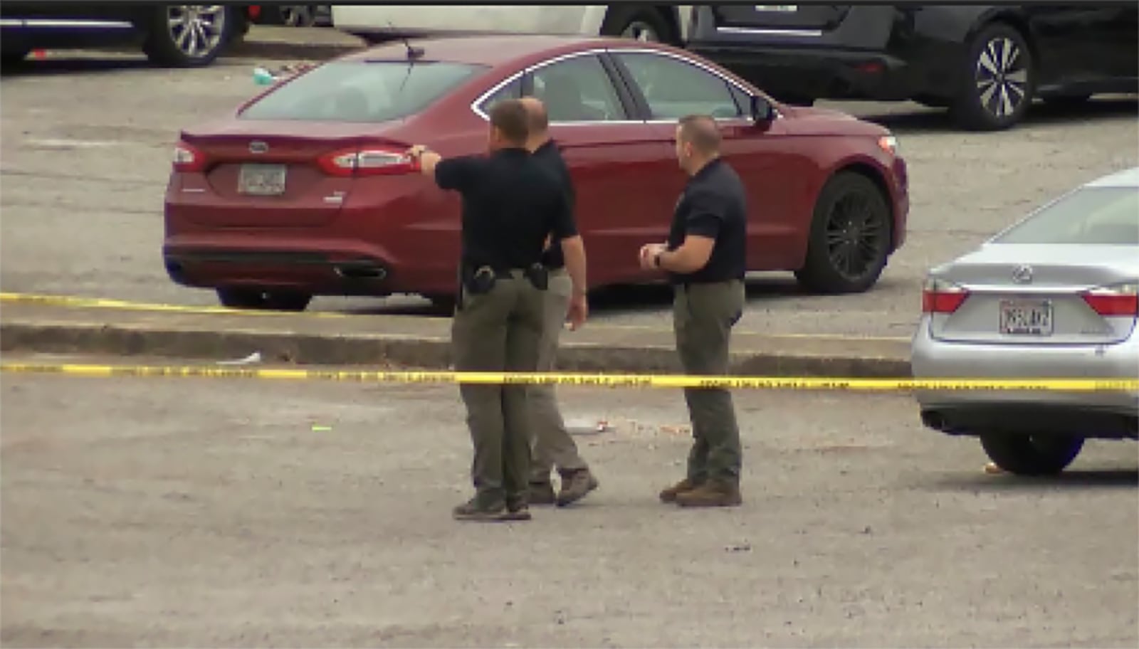 This image taken from video provided by WSFA shows law enforcement at the scene of a shooting at Tuskegee University, Sunday, Nov. 10, 2024, in Tuskegee, Ala. (WSFA via AP)