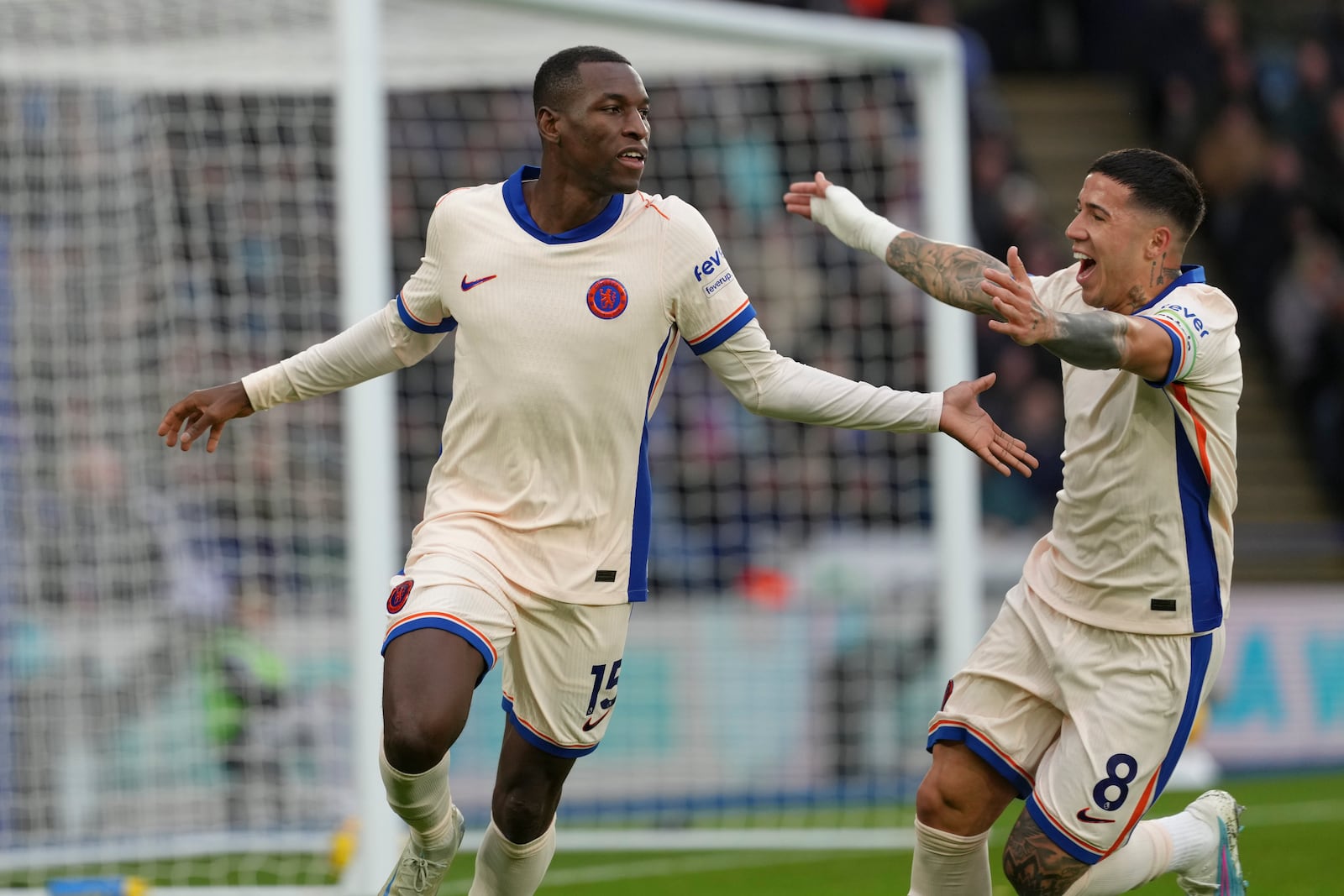 Chelsea's Nicolas Jackson, left, celebrates after scoring the opening goal during the English Premier League soccer match between Leicester City and Chelsea at King Power stadium in Leicester, England, Saturday, Nov. 23, 2024. (AP Photo/Dave Shopland)