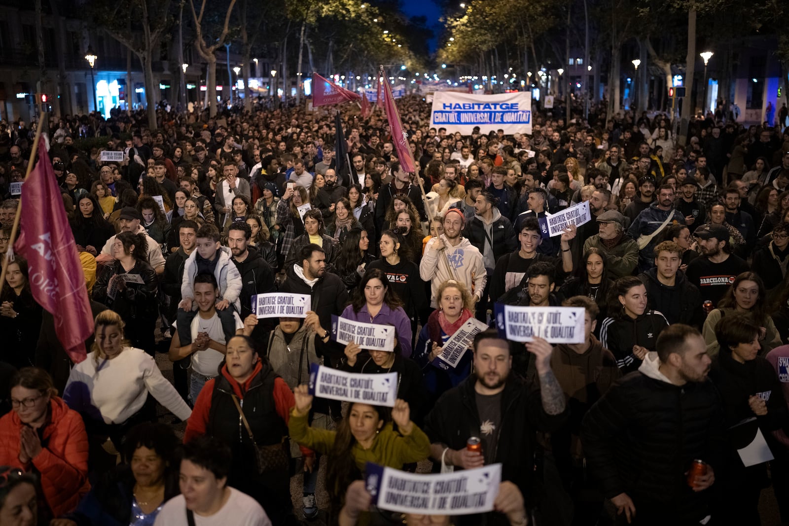 Demonstrators march to protest the skyrocketing cost of renting an apartment in Barcelona, Spain, Saturday, Nov. 23, 2024. (AP Photo/Emilio Morenatti)