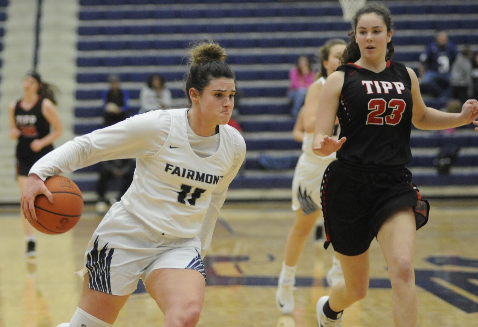 Mali Morgan-Elliott of Fairmont (with ball) draws Tipp defender Makira Webster. Fairmont defeated visiting Tipp 55-26 in a girls high school basketball game on Saturday, Dec. 29, 2018. MARC PENDLETON / STAFF