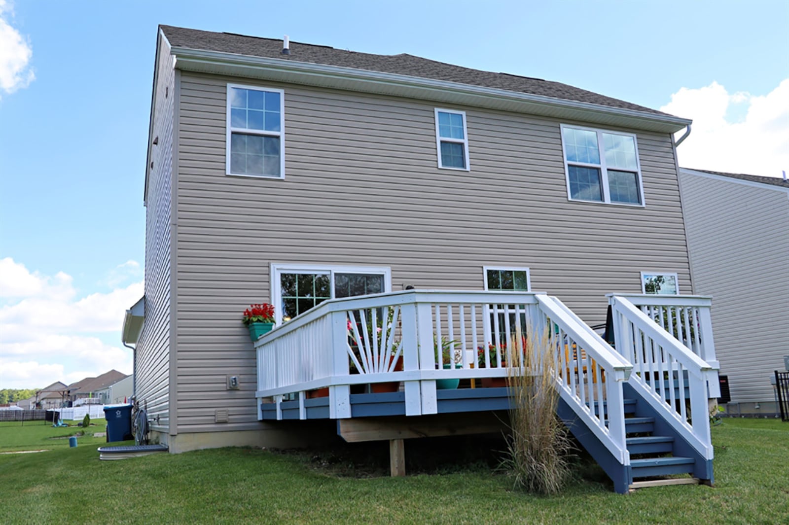 Sliding patio doors open off the dining area to the balcony wooden deck with steps that lead down to the back yard. CONTRIBUTED PHOTO BY KATHY TYLER