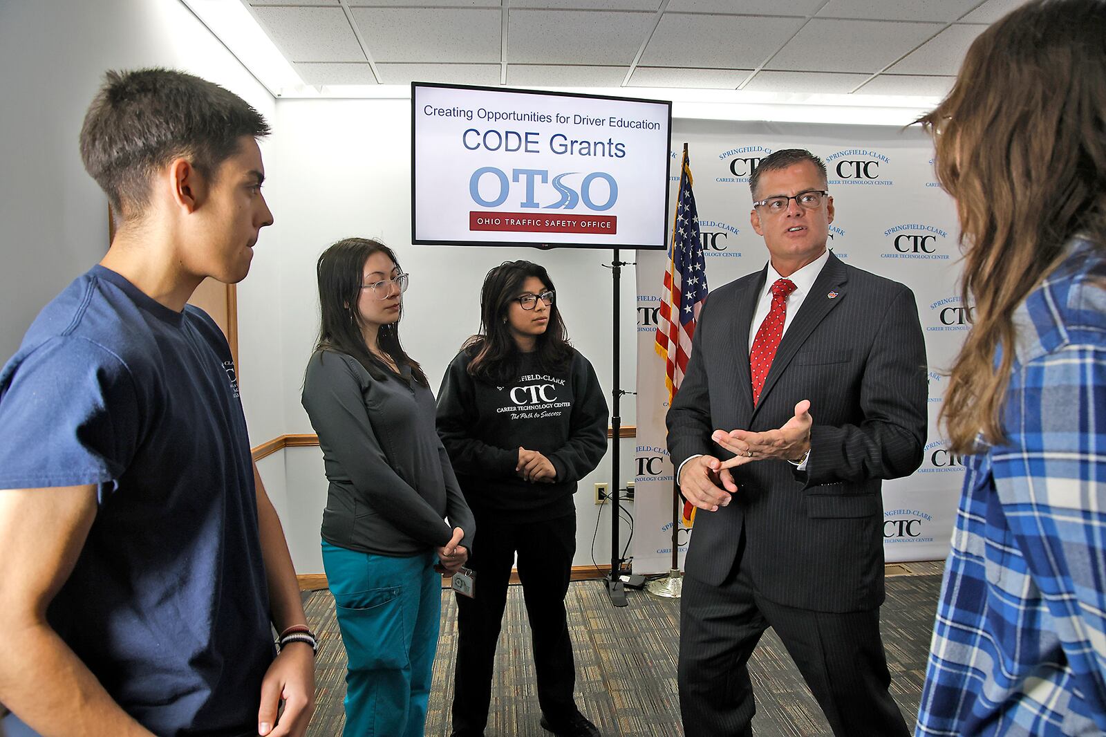 Ohio Department of Public Safety Director Andy Wilson talks with Springfield-Clark CTC students who have taken or are taking the driver training class at CTC following a press conference at the school announcing the Creating Opportunities for Driver Education Grants Tuesday, Jan. 23, 2024. BILL LACKEY/STAFF